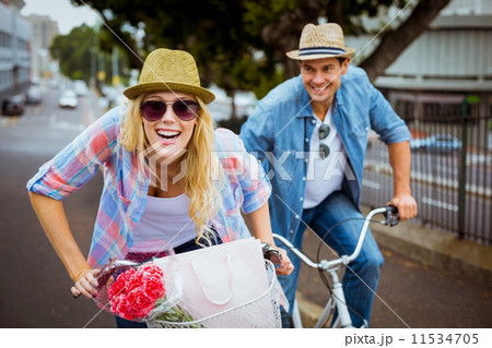 Hip young couple going for a bike ride 11534705
