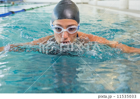 Fit swimmer coming up for air in the swimming pool 11535033