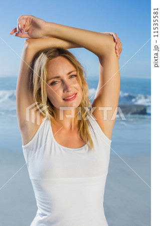 Gorgeous happy blonde posing at the beach 11535581