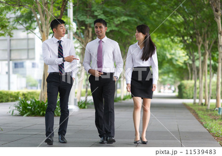 Three young, dynamic and multi-ethnic colleagues having a good time talking among themselves Three young, dynamic and multi-ethnic colleagues having a good time talking among themselves 11539483