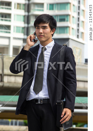 Businessman calling to connect Businessman calling to connect 11543435