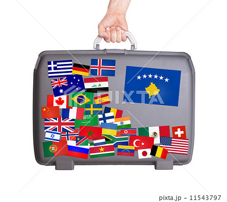 Used plastic suitcase with stickers 11543797