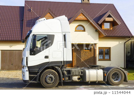 Truck in front of  suburban house 11544044