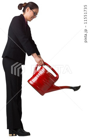 Businesswoman using red watering can Businesswoman using red watering can 11551735
