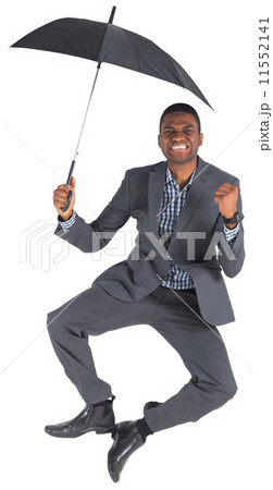 Businessman cheering and holding umbrella 11552141