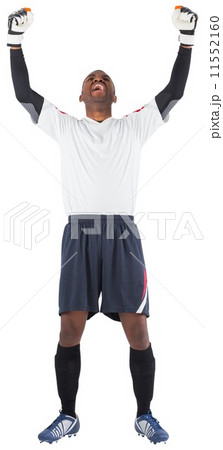 Excited goalkeeper in white cheering 11552160