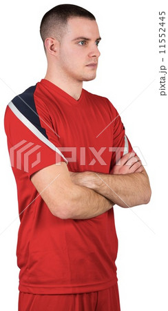 Fit football player standing with arms crossed Fit football player standing with arms crossed 11552445