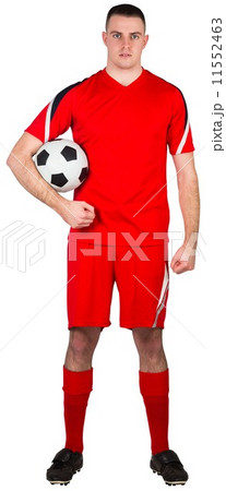 Handsome football player looking at camera Handsome football player looking at camera 11552463