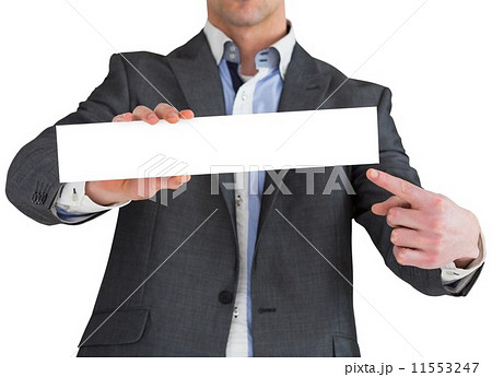 Businessman in grey suit showing card Businessman in grey suit showing card 11553247