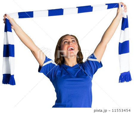Pretty football fan waving scarf 11553454