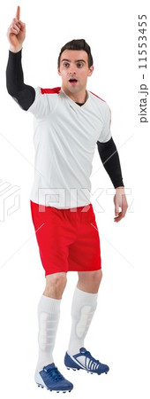 Football player in white raising his hand Football player in white raising his hand 11553455