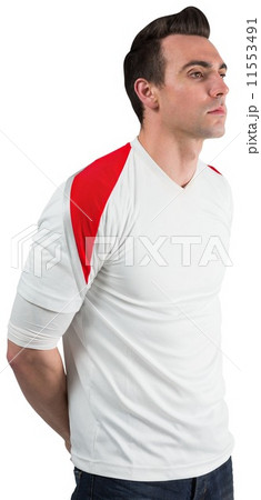 Handsome football fan looking ahead Handsome football fan looking ahead 11553491