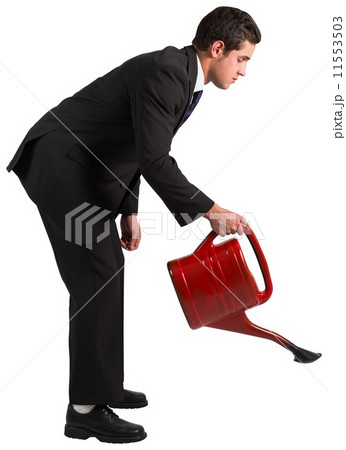Businessman watering with red can 11553503