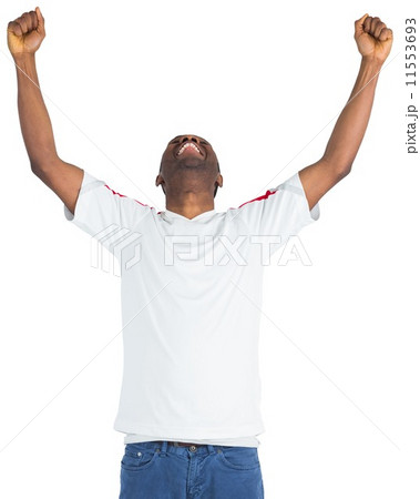 Excited handsome football fan cheering 11553693