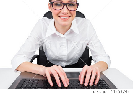Businesswoman typing on a keyboard 11553745