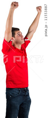 Excited football fan in red cheering 11553887