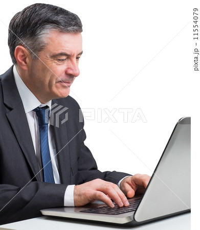 Mature businessman using his laptop Mature businessman using his laptop 11554079