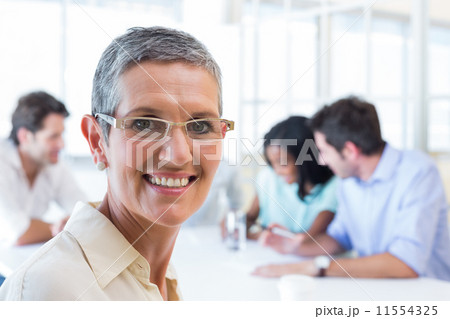 Happy businesswoman smiling at the camera Happy businesswoman smiling at the camera 11554325