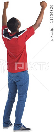 Excited handsome football fan cheering 11554326