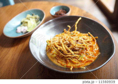 Noodle Khao soi , Thai food on wood background Noodle Khao soi , Thai food on wood background 11560939