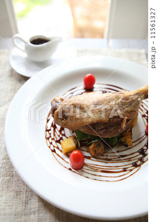 Duck confit , Roasted duck with blueberry sauce Duck confit , Roasted duck with blueberry sauce 11561327