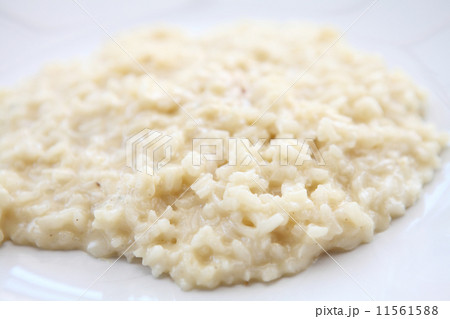 risotto dish with herbs on wood background 11561588