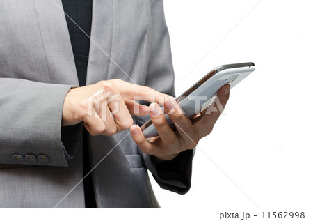 business woman who is using a smart phone business woman who is using a smart phone 11562998