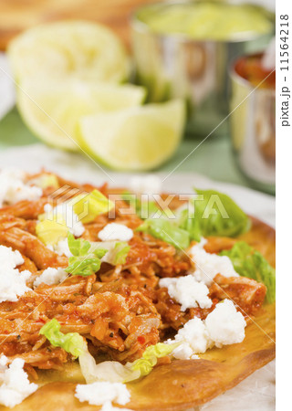 Tostadas - Mexican crispy tortilla with spicy chicken tinga  11564218