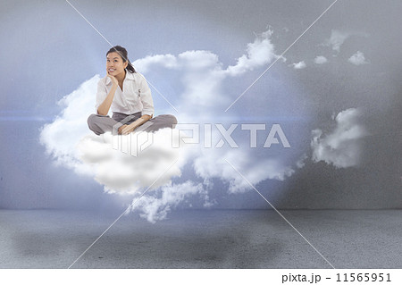 Composite image of annoyed brunette carrying large key 11565951