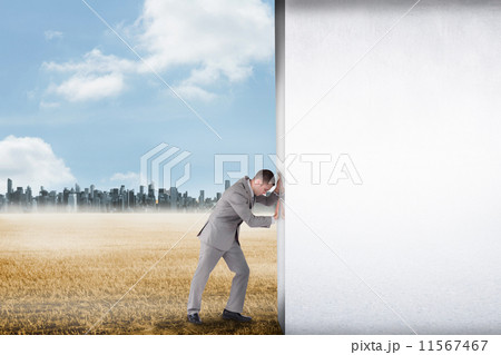 Composite image of hand holding tablet pc 11567467