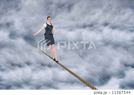 Composite image of woman looks straight ahead as she celebrates 11567544