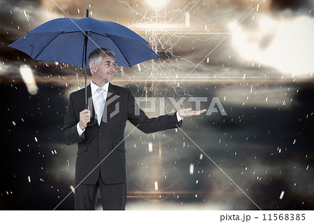 Composite image of handsome young man showing card 11568385