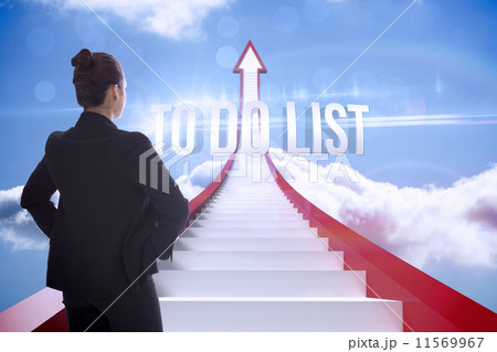 Composite image of annoyed brunette carrying large key Composite image of annoyed brunette carrying large key 11569967