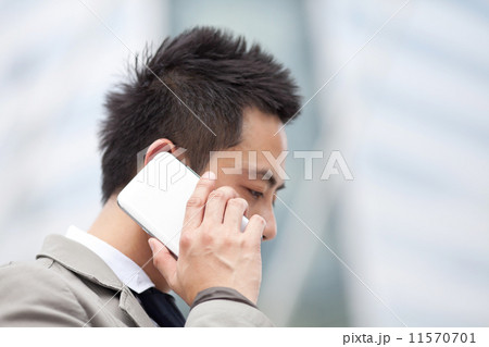 Asian business man speaking mobile phone Asian business man speaking mobile phone 11570701