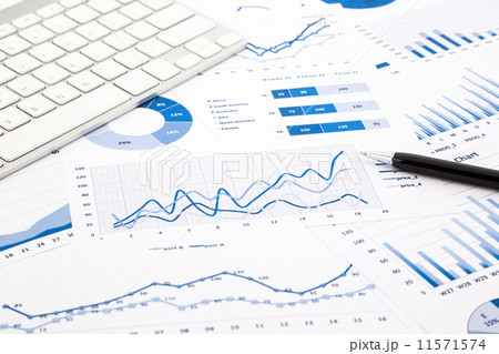blue graph and chart reports on office table 11571574