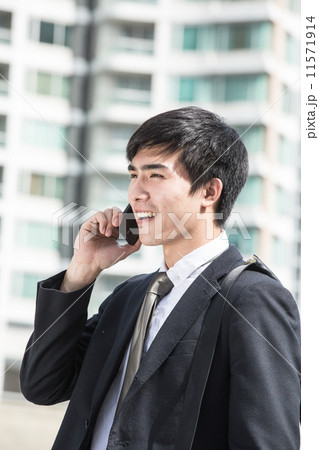 Businessman calling to connect Businessman calling to connect 11571914