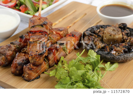 Pork kebabs with peppers. Salad, grilled mushroom & BBQ sauce Pork kebabs with peppers. Salad, grilled mushroom & BBQ sauce 11572870