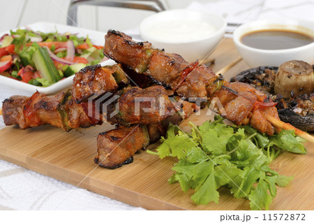 Pork kebabs with peppers. Salad, grilled mushroom & BBQ sauce Pork kebabs with peppers. Salad, grilled mushroom & BBQ sauce 11572872