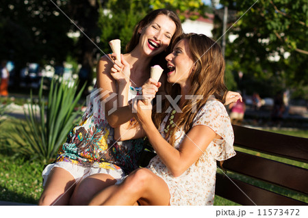 Two beautiful young women having fun in the city Two beautiful young women having fun in the city 11573472