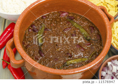 Chili Con Carne with onions, cheese, rice, sour cream & chips Chili Con Carne with onions, cheese, rice, sour cream & chips 11576947