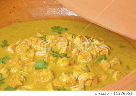 Moqueca de Camarao - Brazilian prawns in coconut milk and dende oil in a clay pan. Food from Bahia 11576952