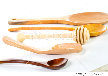 Wood spoon isolated placed Wood spoon isolated placed 11577239