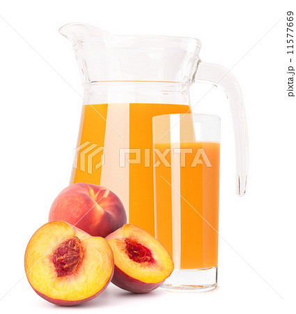 Peach fruit juice in glass jug 11577669