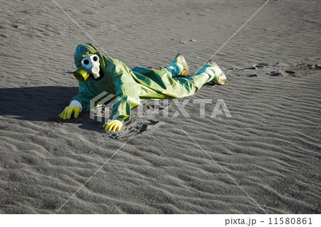 Man in gas masks crawling on poisoned soil 11580861