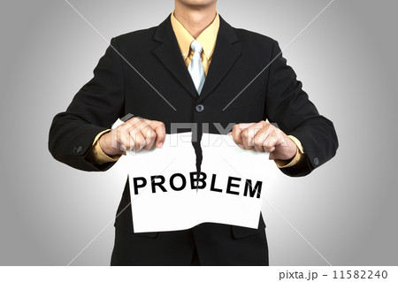 Businessman tear paper with word Problem 11582240