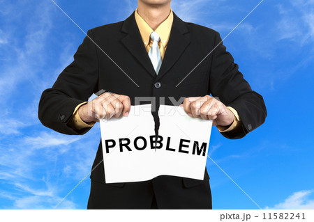 Businessman tear paper with word Problem 11582241