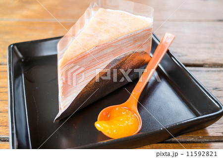 Light cream crepe cake with fresh orange Light cream crepe cake with fresh orange 11592821