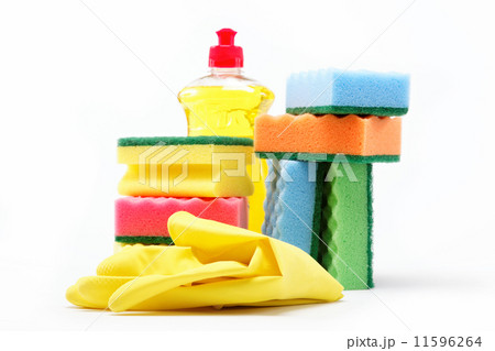Detergent bottle, rubber gloves and cleaning sponge on a white b 11596264