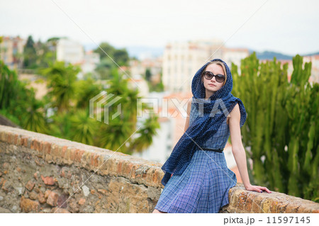 Elegant young woman in the Old town of Cannes 11597145