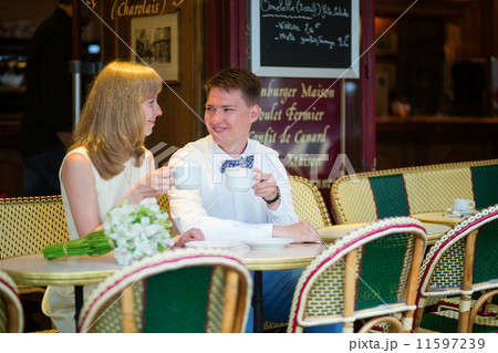 Just married couple drinking coffee in a cafe Just married couple drinking coffee in a cafe 11597239